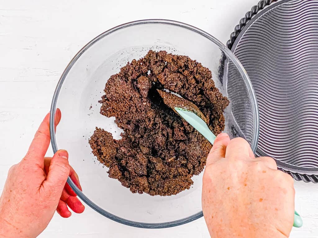 Butter and chocolate cookies mixed in a mixing bowl.