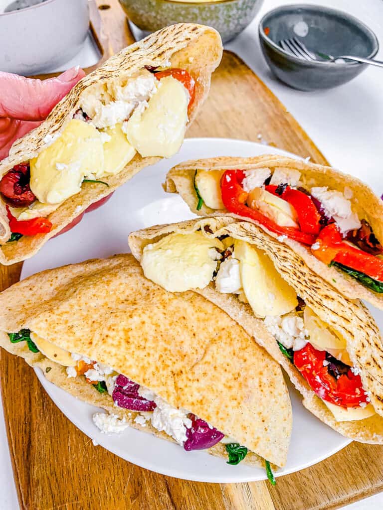 Cheese stuffed pita on a white plate.