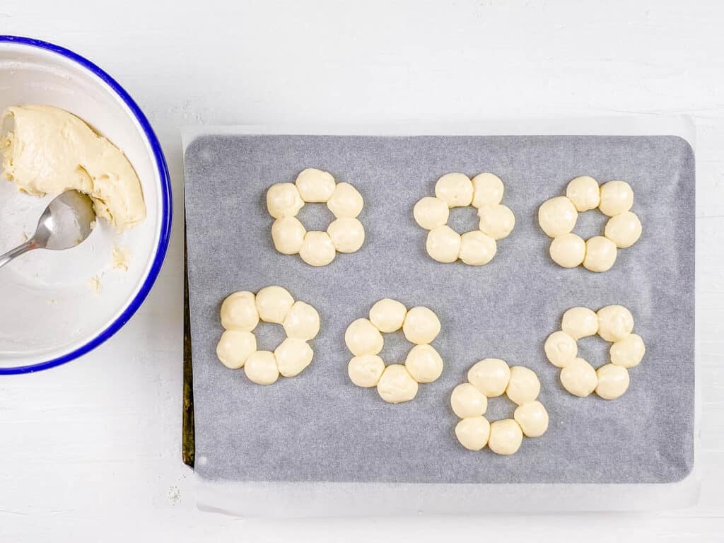 Pon de ring donut dough on a sheet pan.