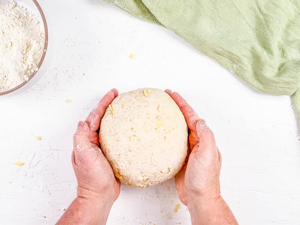 Kneaded bread dough on a countertop.