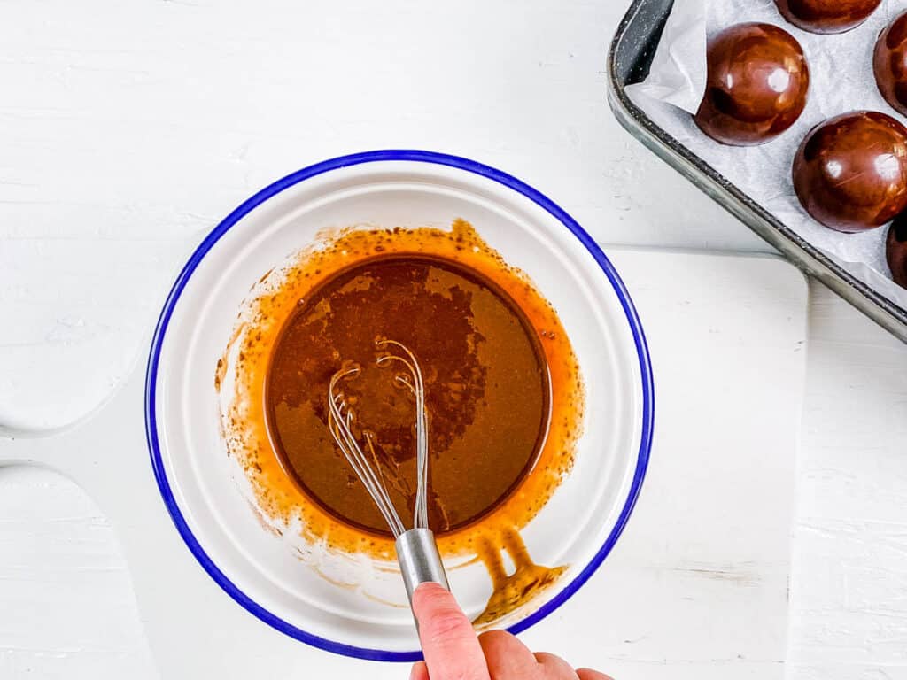 Chocolate ganache mixed in a bowl.