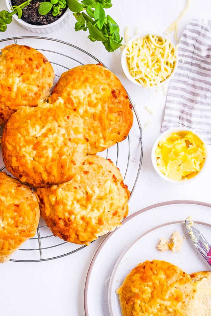 Homemade cheese buns on a white plate.