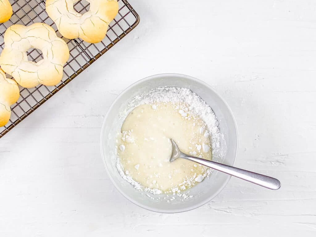 Icing for pon de ring donuts in a mixing bowl.