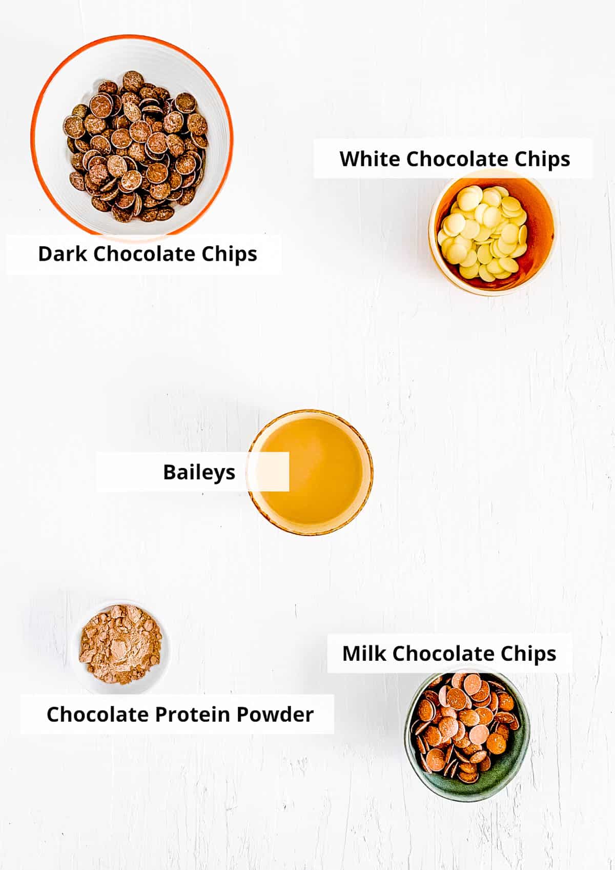 Ingredients for Baileys hot chocolate bomb recipe on a white background.