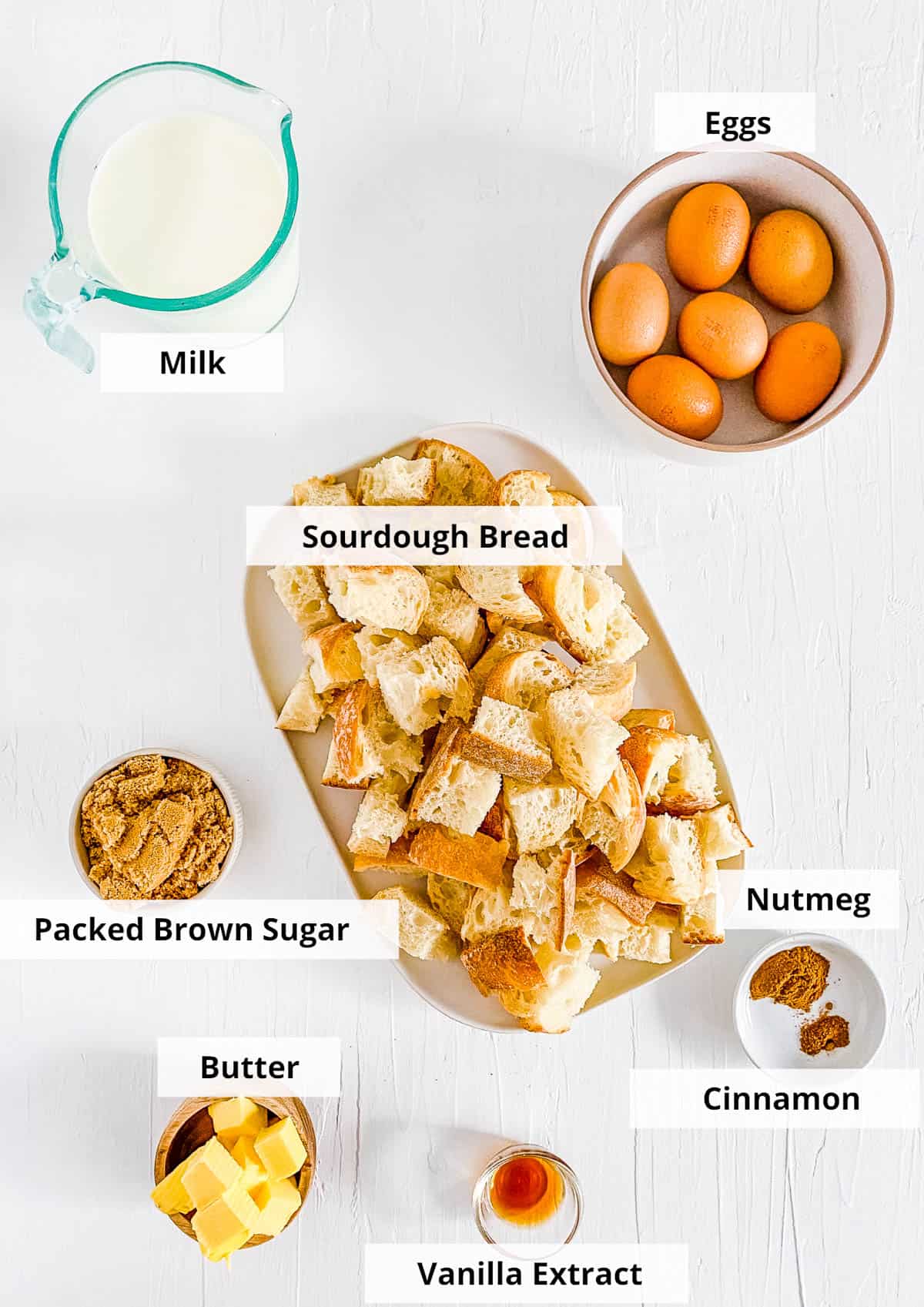 Ingredients for crock pot french toast casserole recipe on a white background.