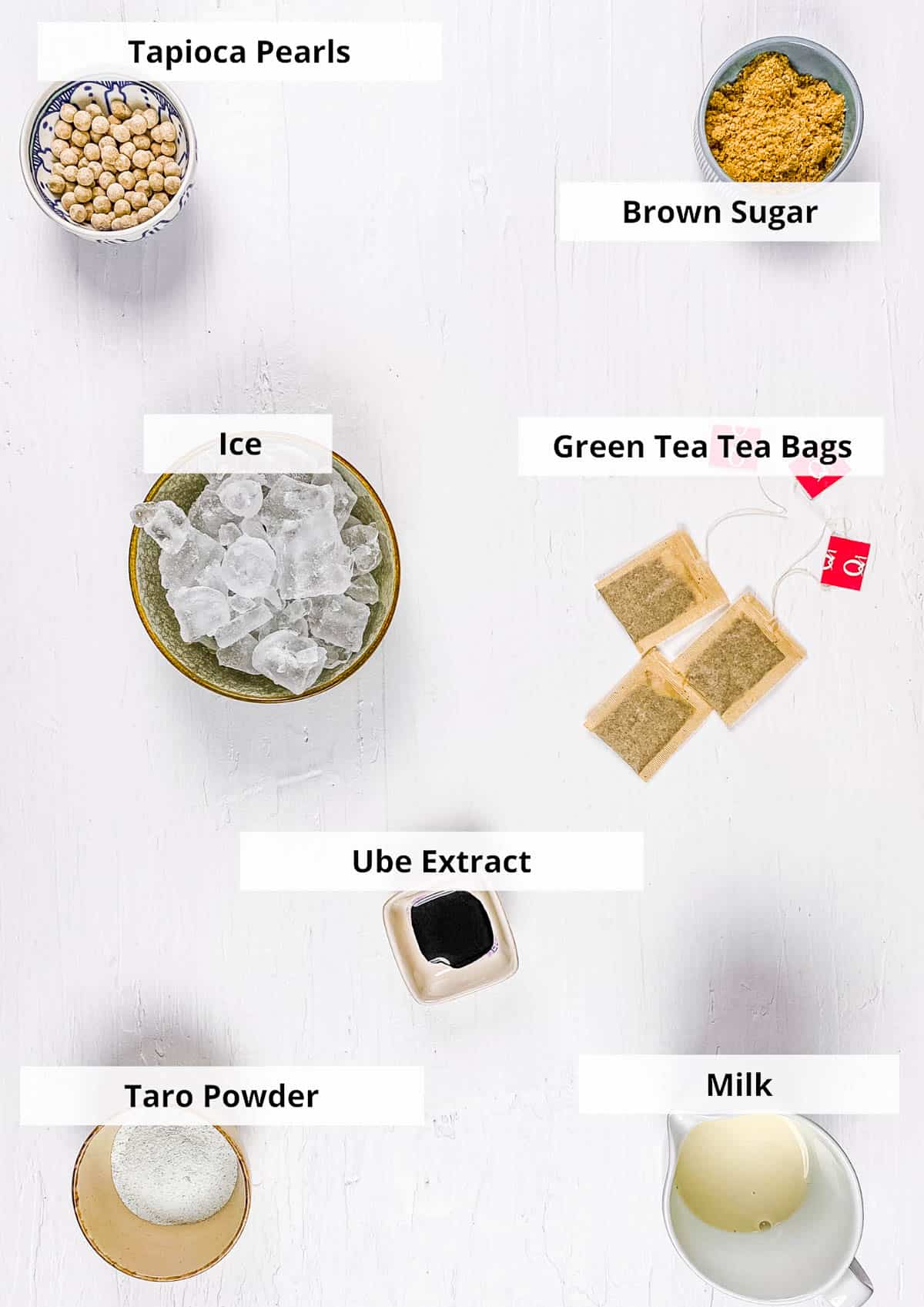 Ingredients for taro milk tea recipe on a white background.