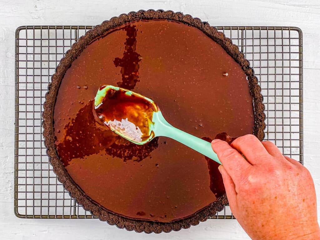 Chocolate filling added to tart crust in baking dish.