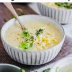 two bowls of potato soup with cheese and chives
