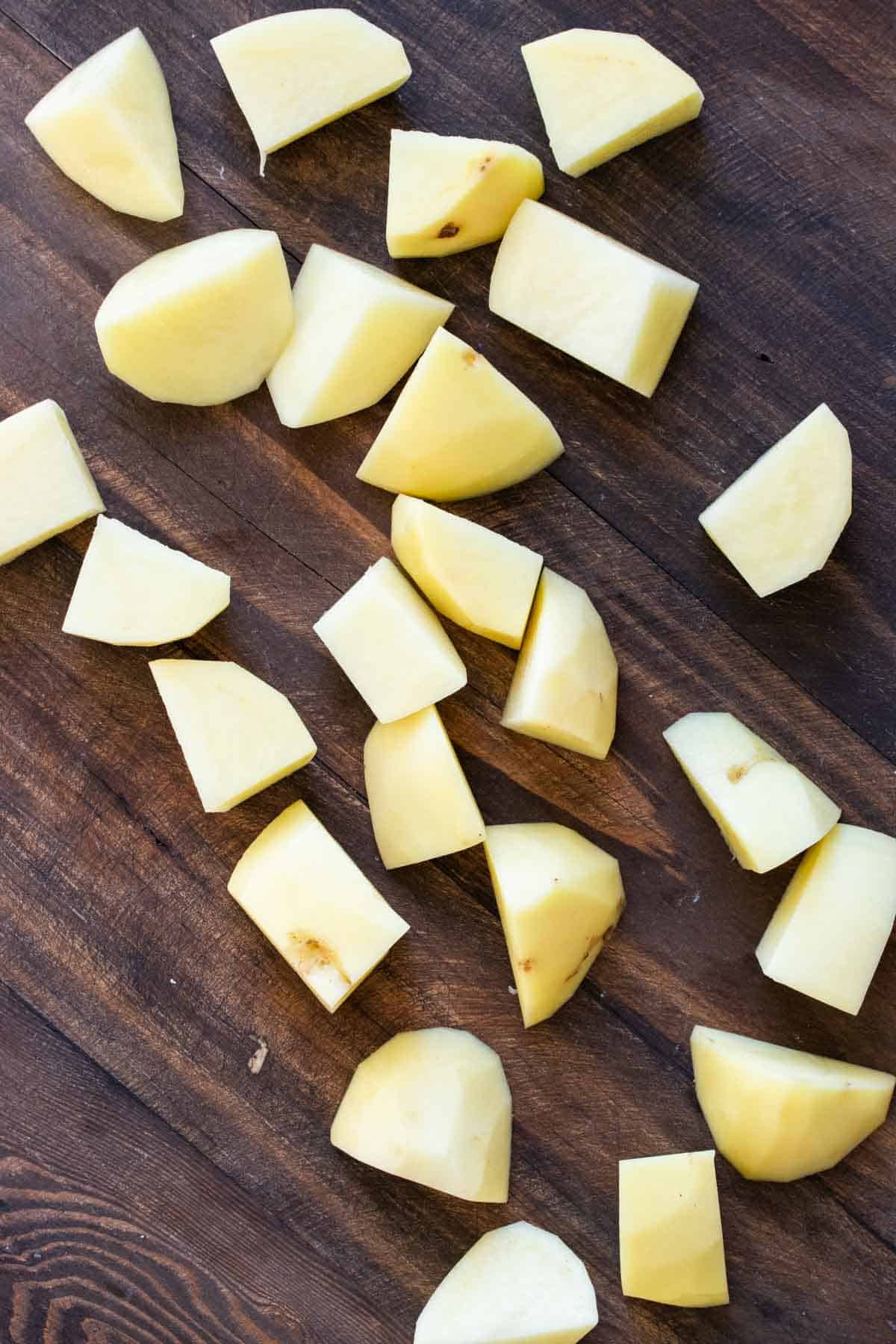 Cut potatoes on a wooden surface