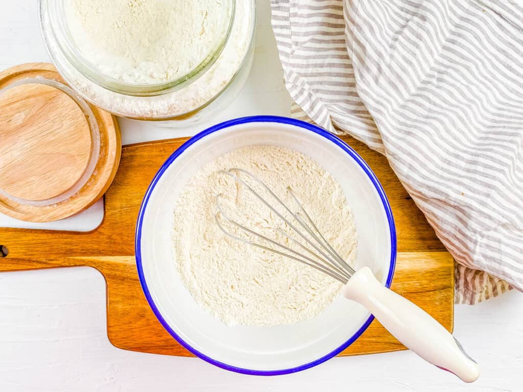 Dry ingredients for vegan naan mixed in a bowl.