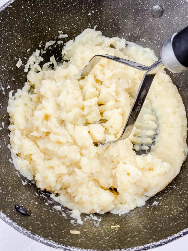 Mashed potatoes in a stock pot.