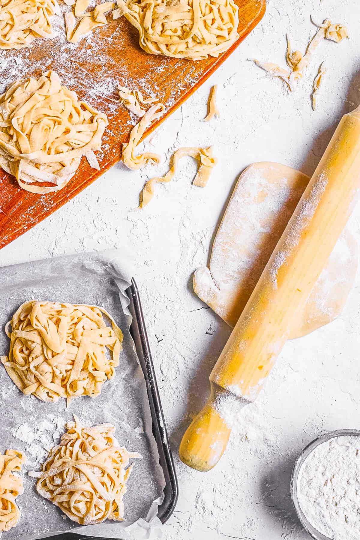 3 ingredient homemade vegan pasta on a baking sheet lined with parchment paper.