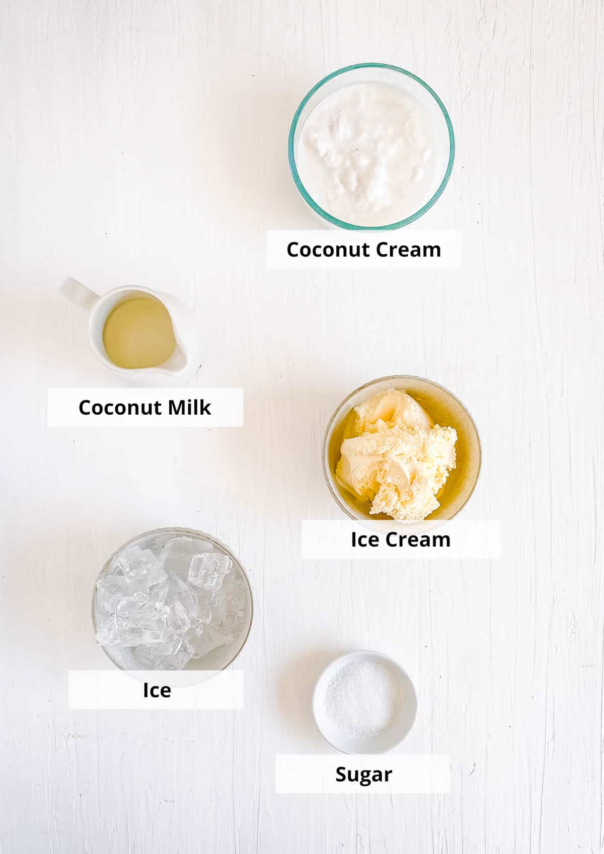 Easy coconut milkshake ingredients on a white background.