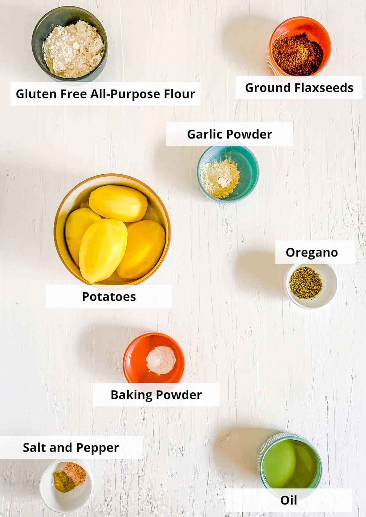 Ingredients for vegan potato pancakes on a white background.