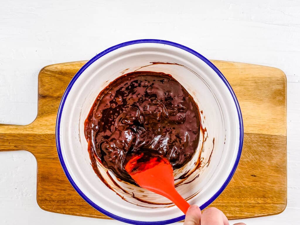 Chocolate ganache in a mixing bowl.