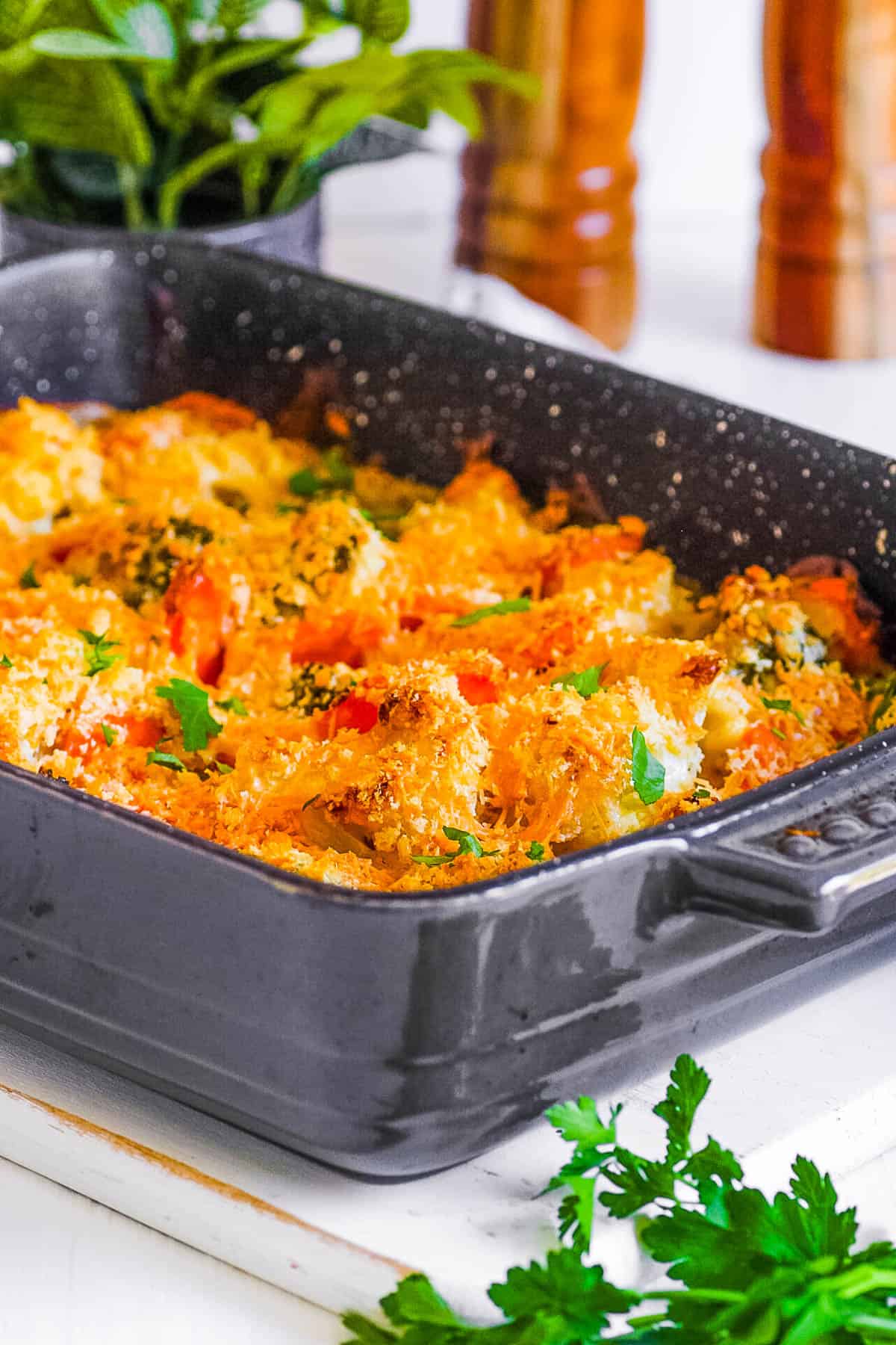Vegetable au gratin with cheese in a baking dish.