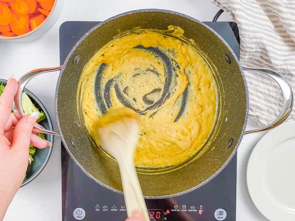 Roux being made in a large pot on the stove.