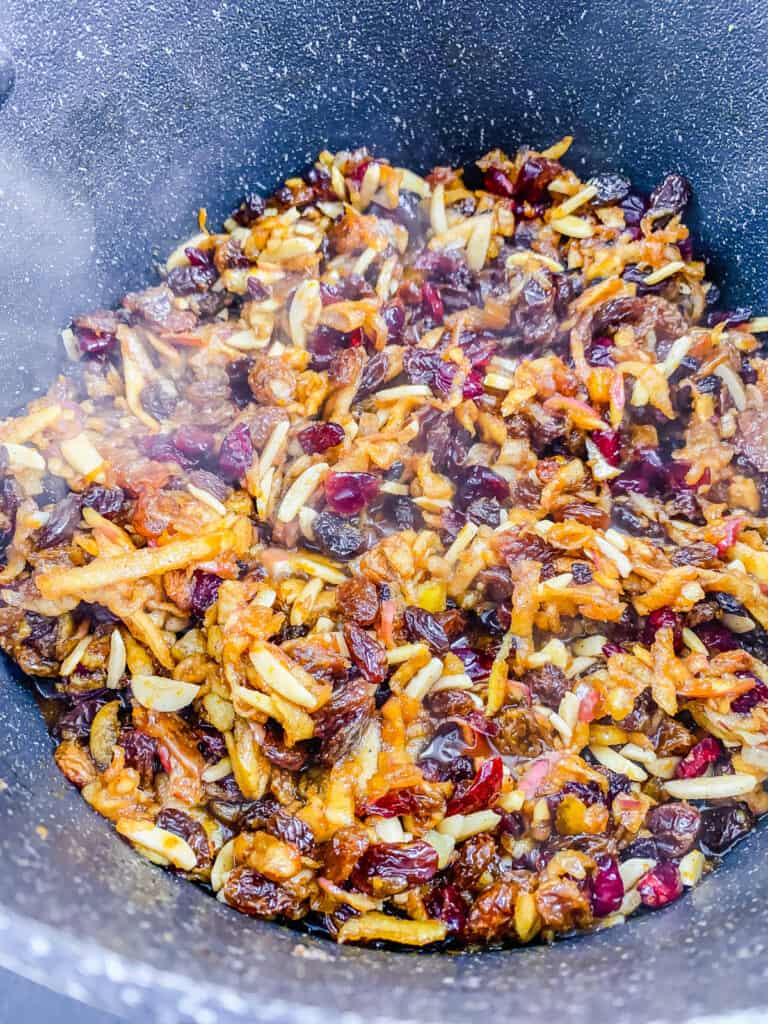 Plant based mincemeat cooking in a pot on the stove.