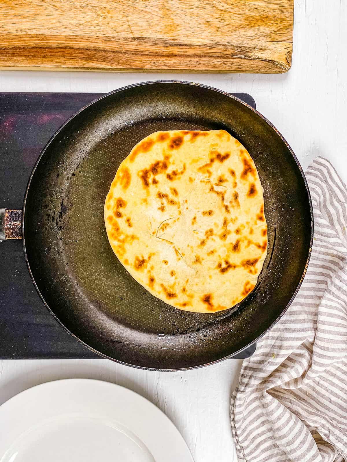 No yeast flatbread cooking on the stovetop.