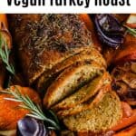 a vegan turkey with roasted carrots