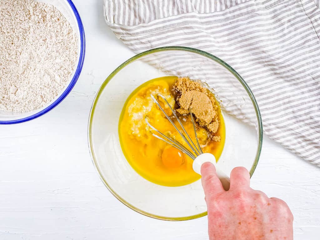 Wet ingredients for muffins mixed in a bowl.