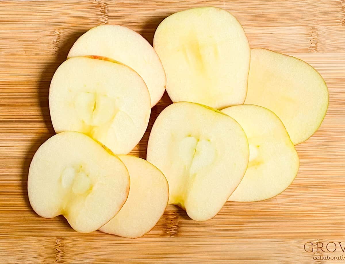 Apple slices on cutting board.