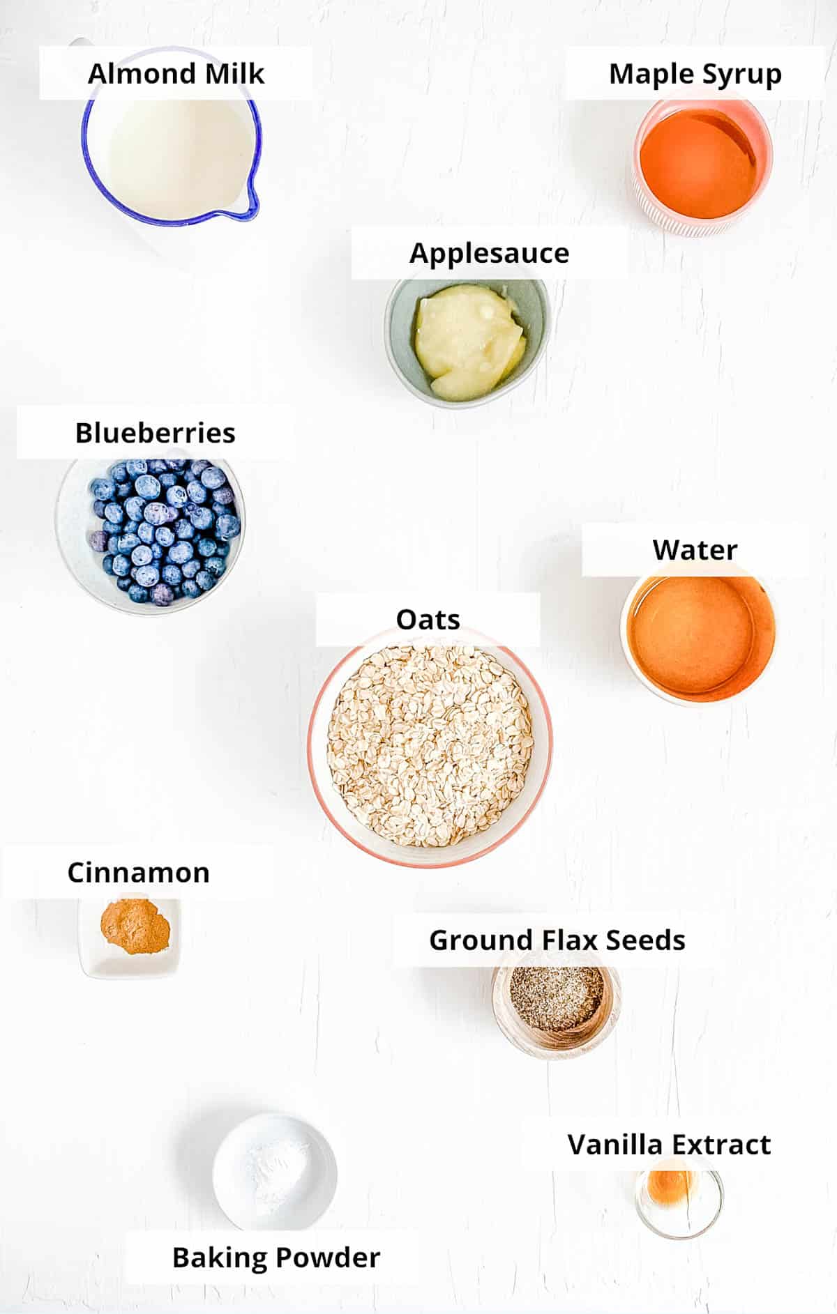 Ingredients for vegan baked oatmeal recipe on a white background.