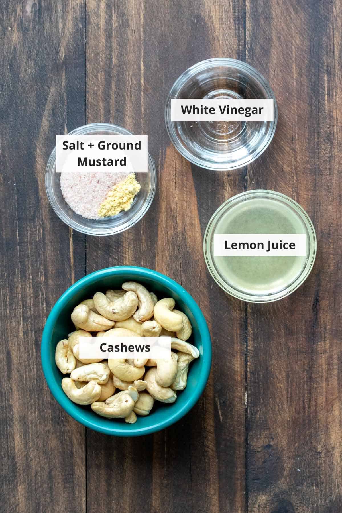 Ingredients for vegan parmesan cheese recipe on a wood background.