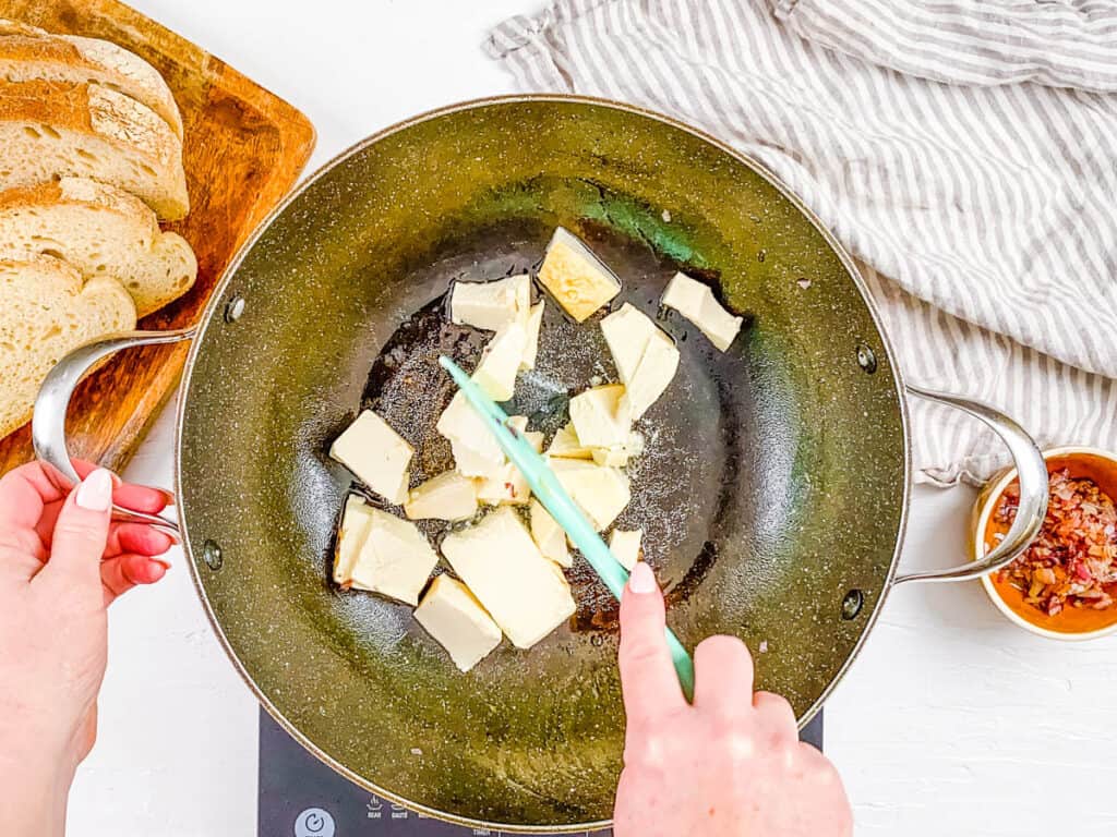 Soft tofu scrambled egg in a pan.