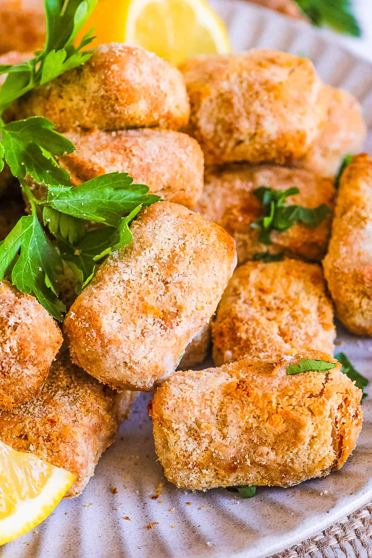 Vegan air fried tofu nuggets on a white plate.