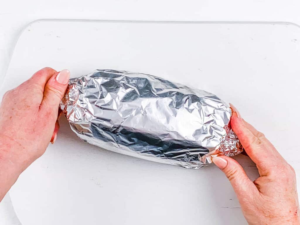 Vegan holiday roast wrapped in tin foil.