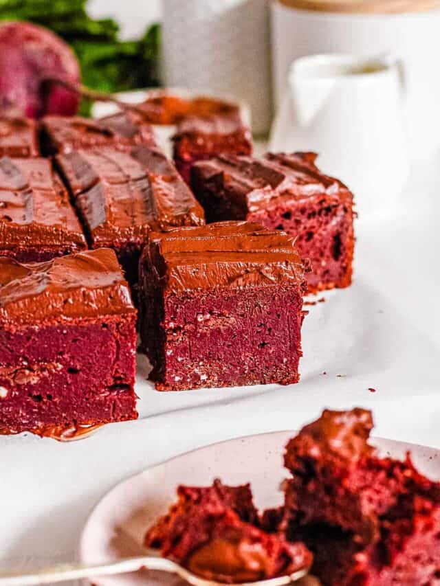 Healthy beet brownies cut and presented on a white tray.