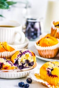 Dairy free blueberry muffins served on a white plate.