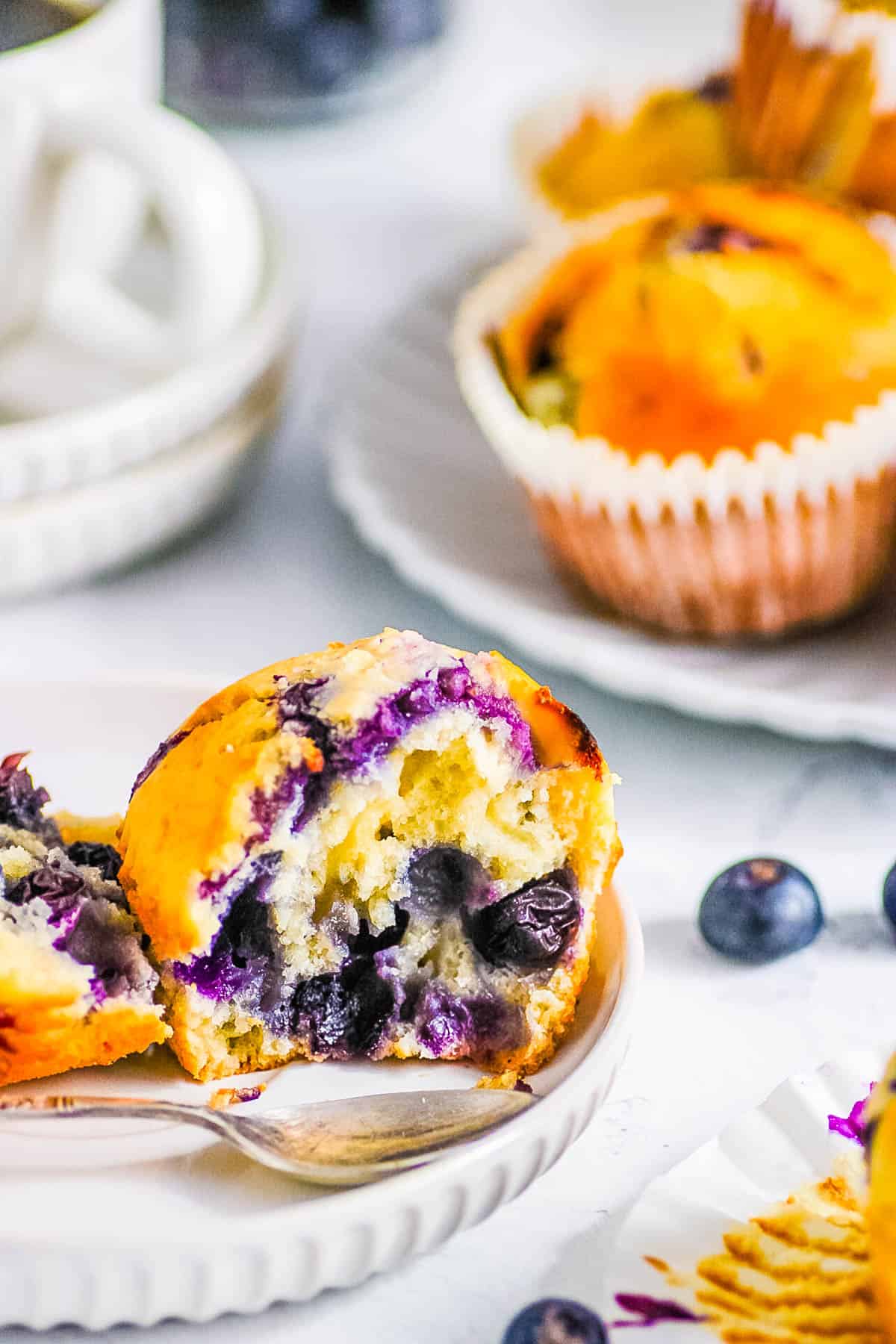 Dairy free blueberry muffins served on a white plate.