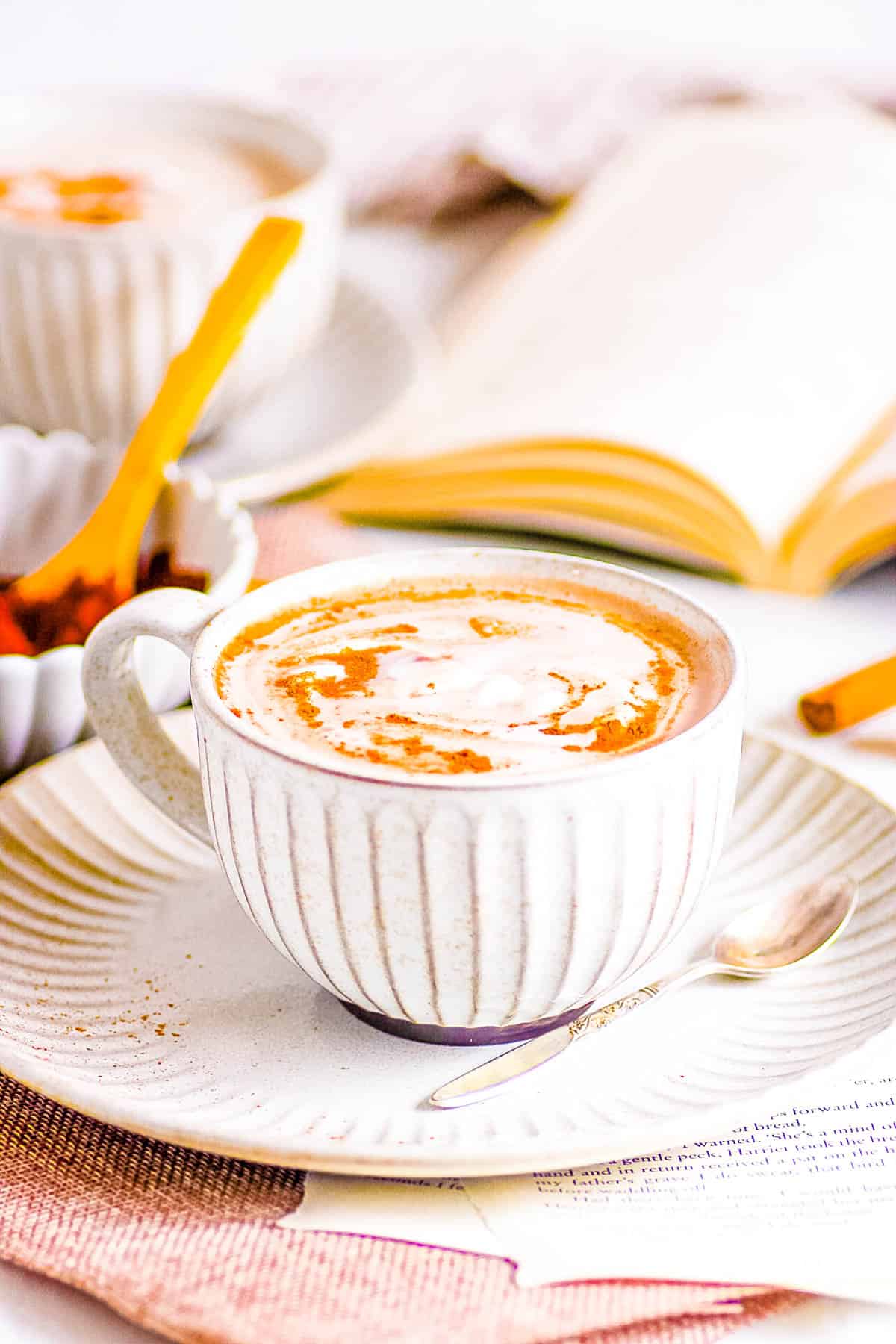 Homemade oat milk hot chocolate in a mug on a saucer.