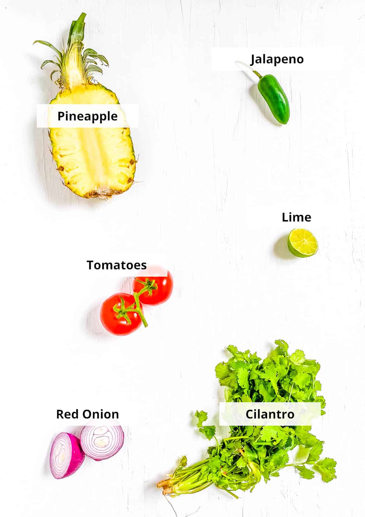 Ingredients for easy pineapple pico de gallo recipe on a white background.