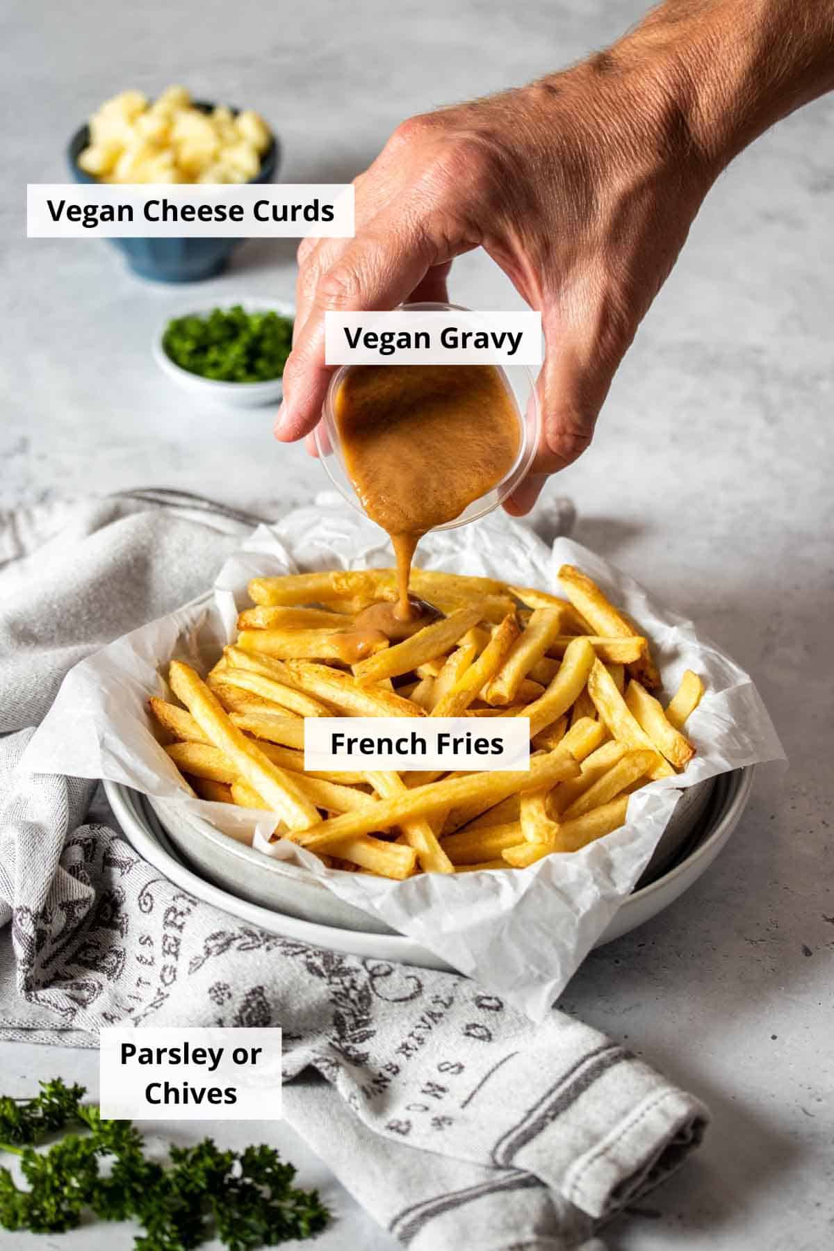 Ingredients for vegan poutine recipe on a white background.