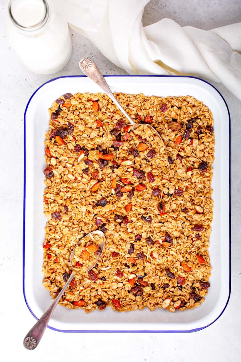 Healthy homemade low calorie granola on a baking sheet.