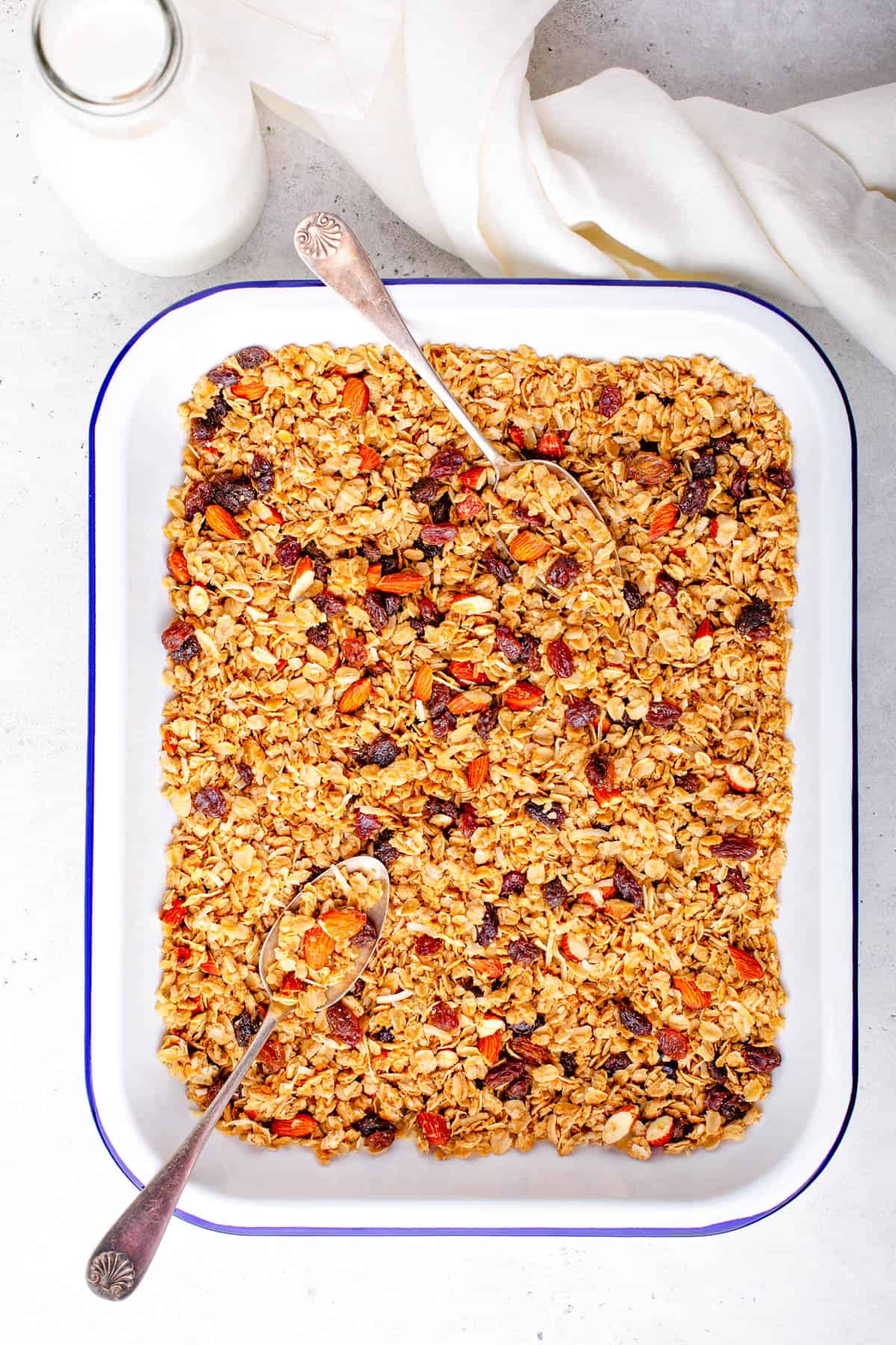 Healthy ،memade low calorie granola on a baking sheet.