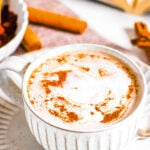 Homemade oat milk hot chocolate in a mug on a saucer.