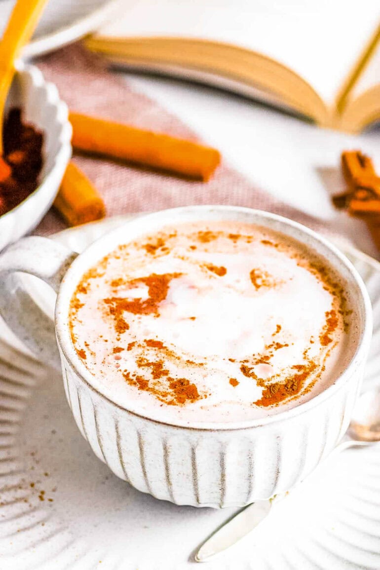 Homemade oat milk hot chocolate in a mug on a saucer.