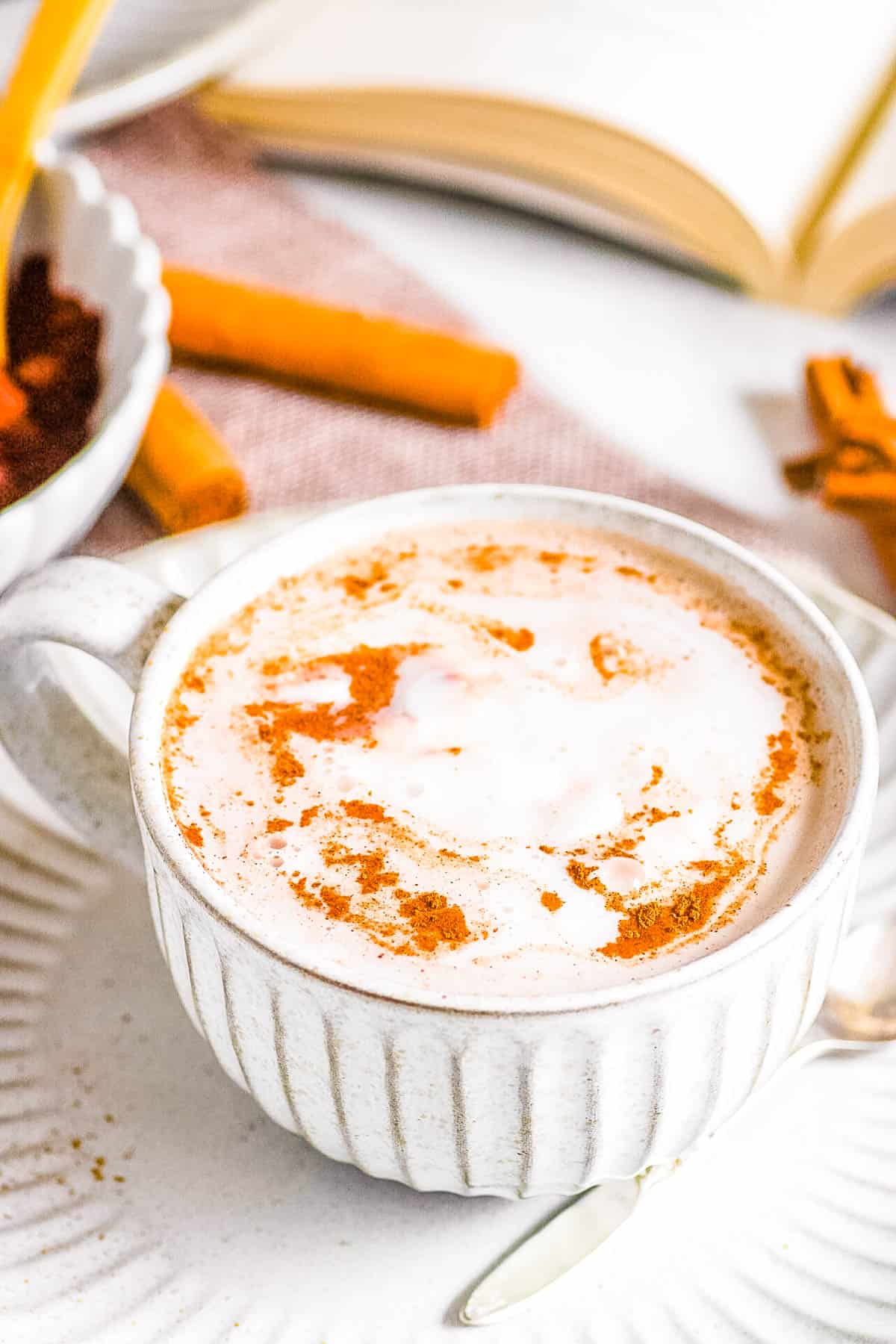 Homemade oat milk hot chocolate in a mug on a saucer.