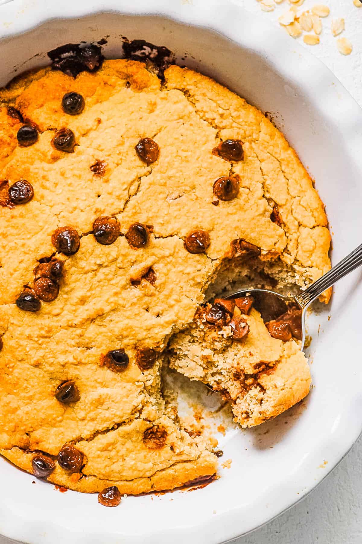 Easy chocolate chip baked oatmeal in a white baking dish.