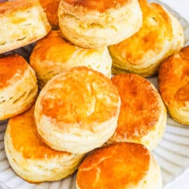 Biscuits without baking powder stacked on a plate.