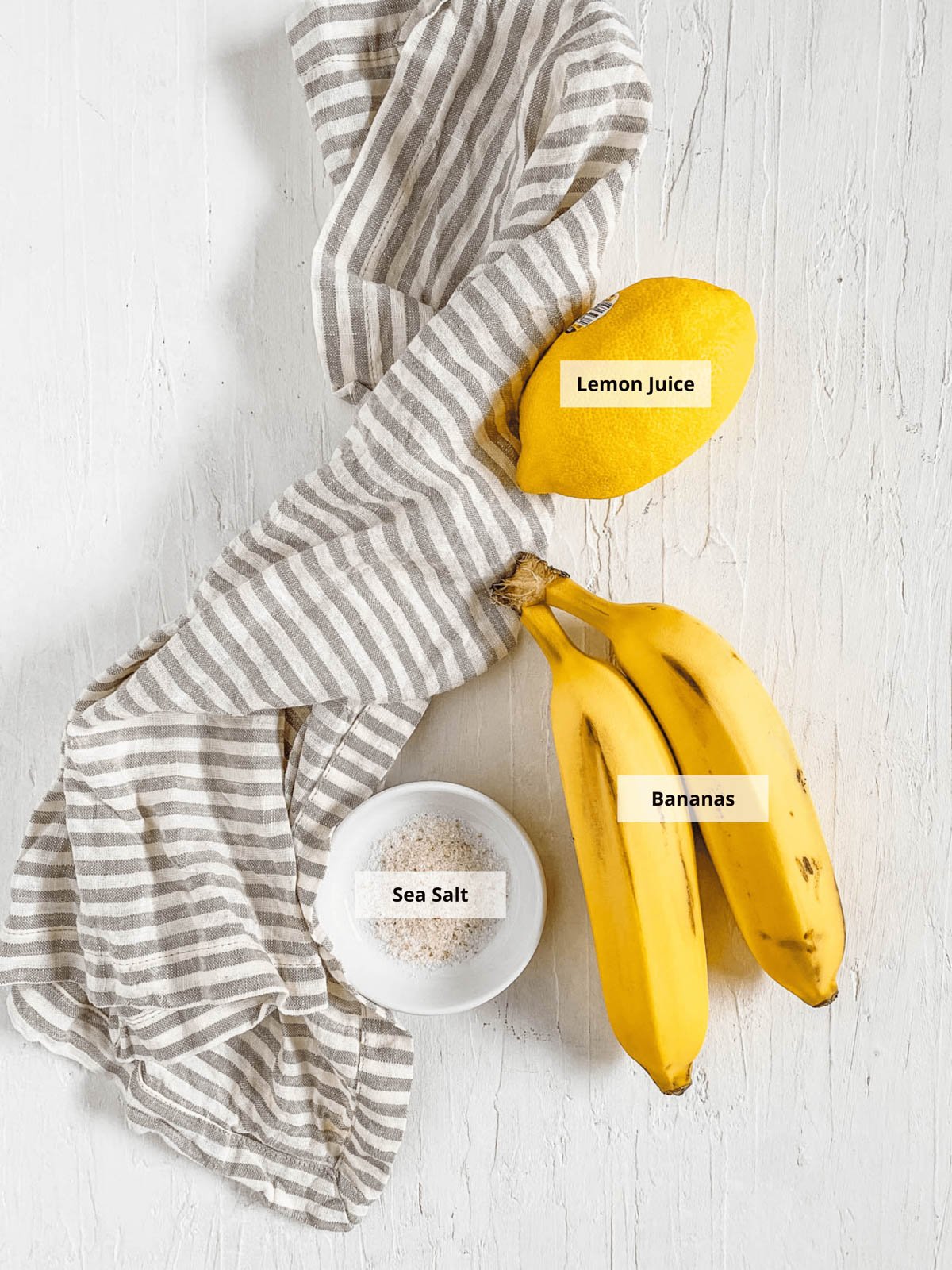 Ingredients for air fryer banana chips recipe on a white background.