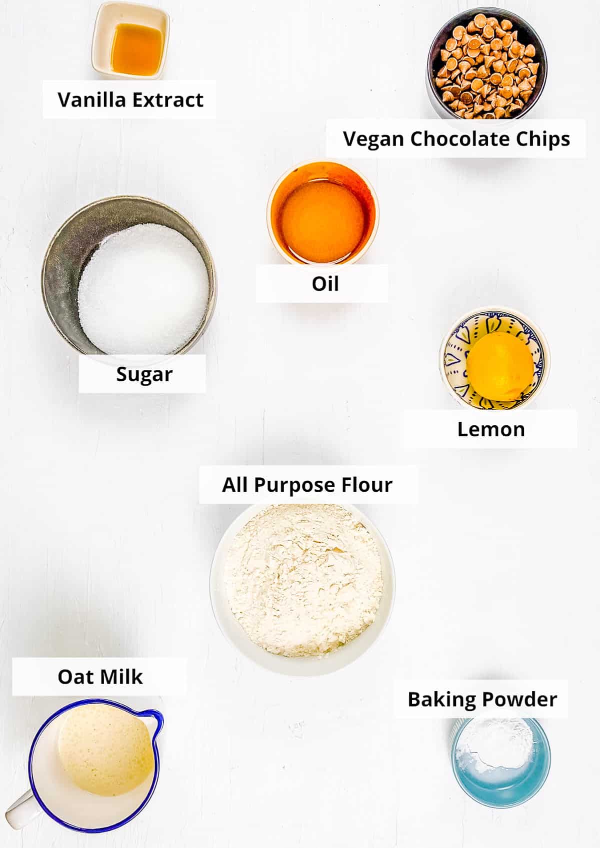 Ingredients for easy vegan chocolate chip muffins recipe on a white background.