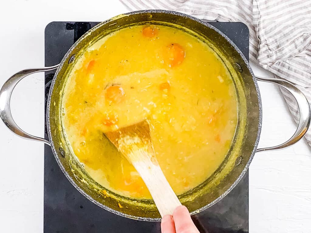 Shorbet adas cooking in a pot on the stove.