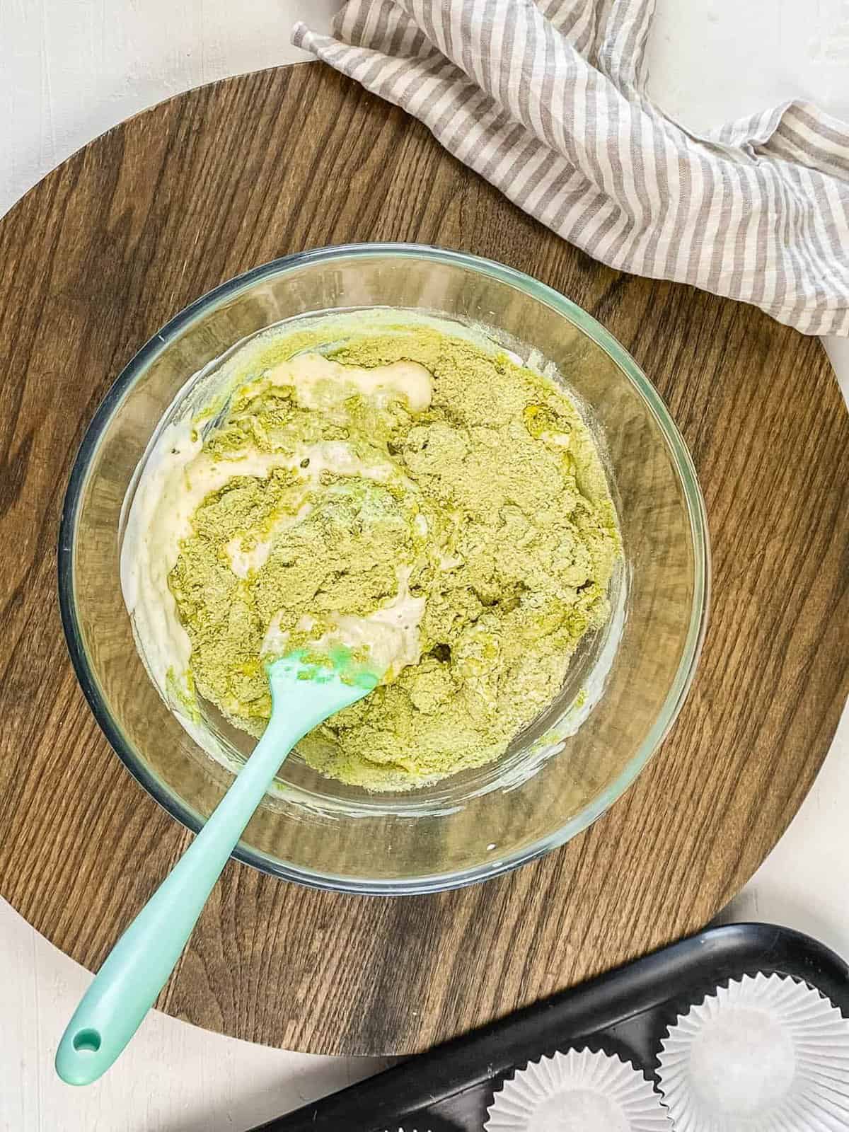 matcha tea powder added to mixing bowl