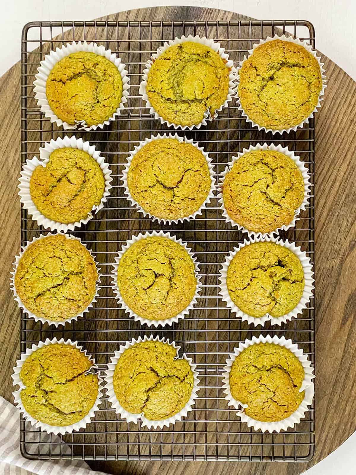 easy matcha muffins fresh out of the oven on a wire rack