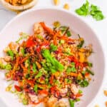 Meatless low carb vegetarian egg roll in a bowl, served in a white bowl, garnished with green onions.